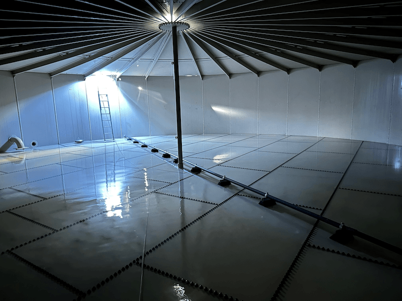 Internal photo of a large water tank on an agricultural property.